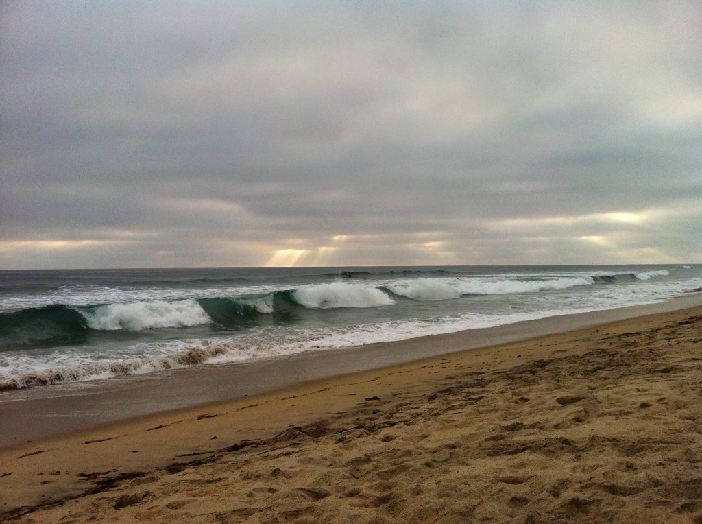 Green wave and distant beam of light.